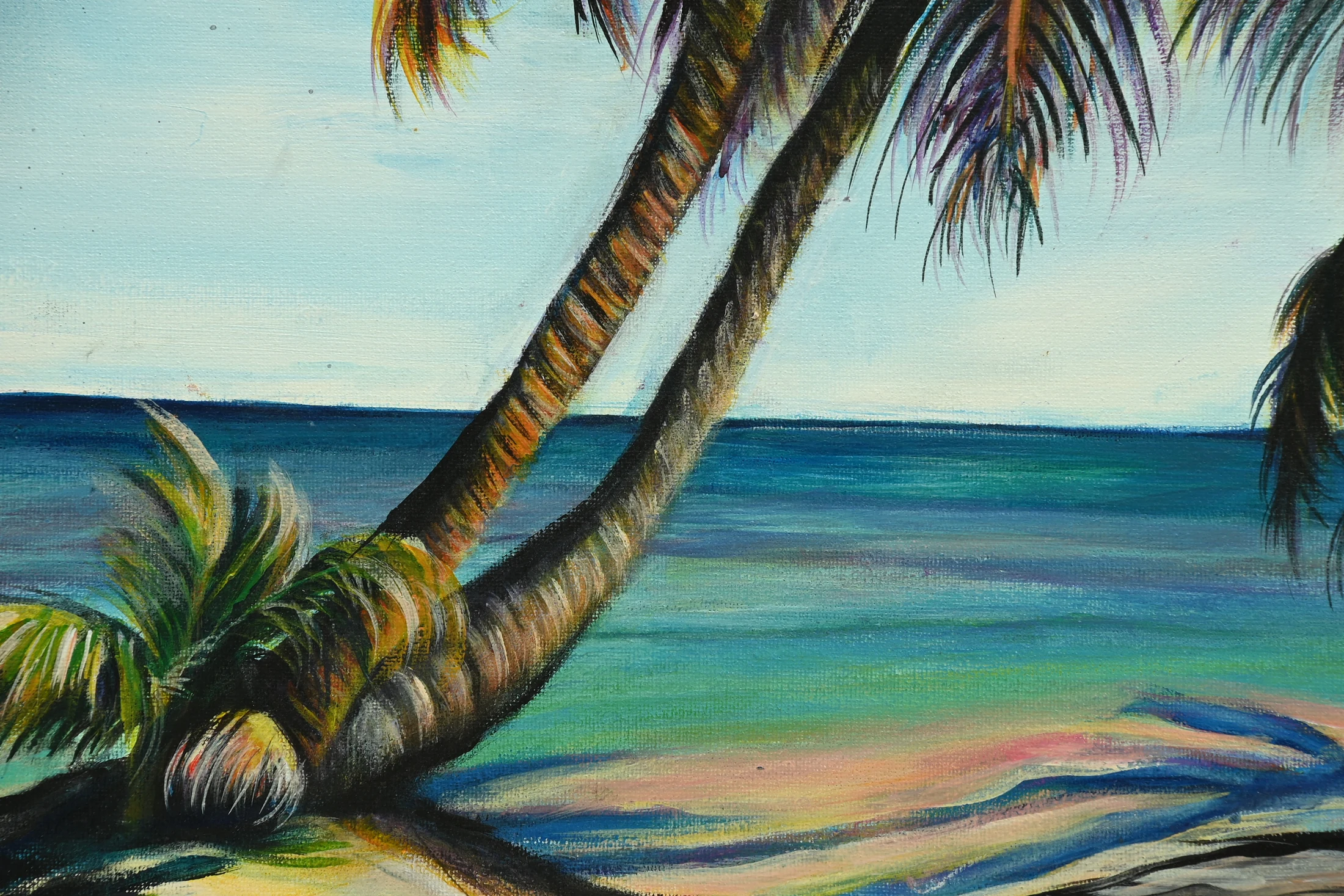 Close detail of curved palm trunks and turquoise water in Palm Tree Ocean Sunset